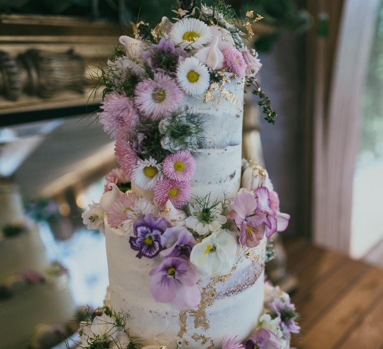 Semi Naked Wedding Cake with Trailing Pink Flower Decor