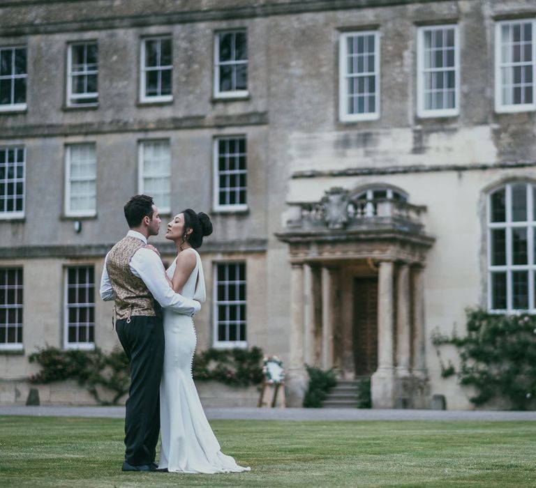 Elegant Bride and Groom Standing infant Of Their Country House Wedding Venue