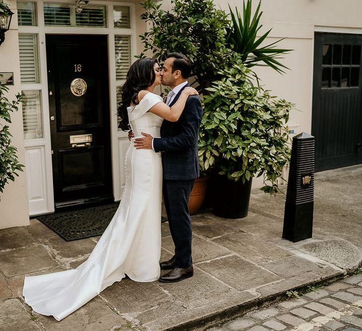 Bride and groom embracing at first look