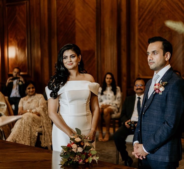 Bride and groom exchange vows at Old Marylebone Town Hall civil ceremony