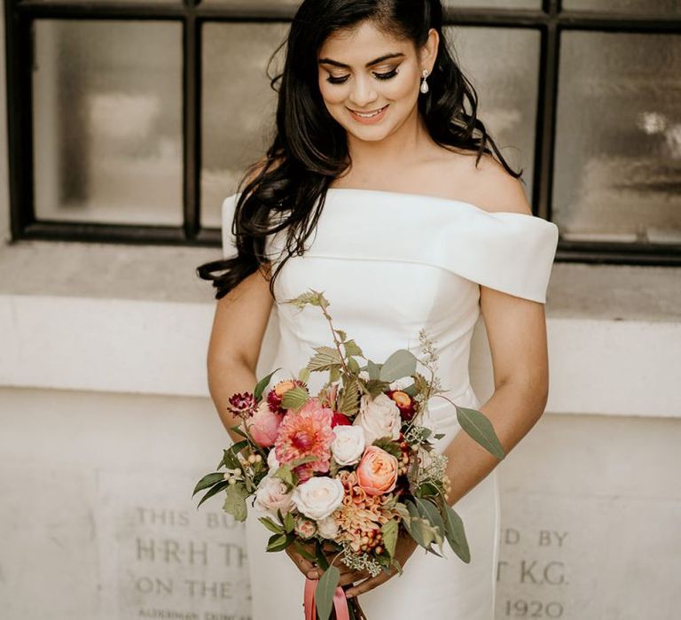 Beautiful Indian bride in off the shoulder wedding dress