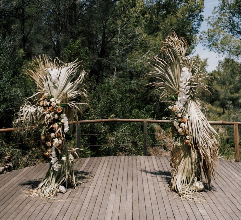 Nude Wedding Altar Wedding Flowers with Dried Palm Leaves, Roses and Orchids