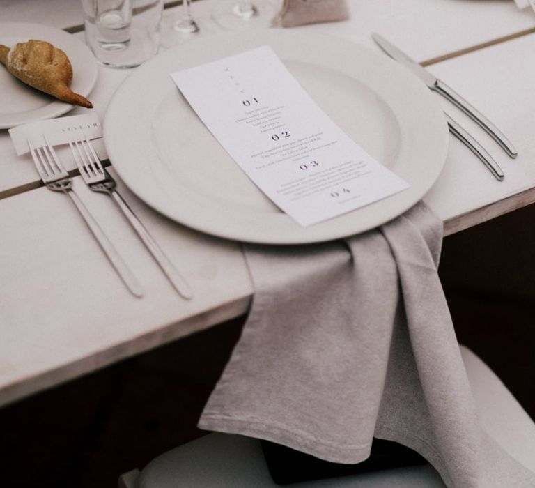 Minimalist Place Setting with Natural Linen Napkin and Menu Card