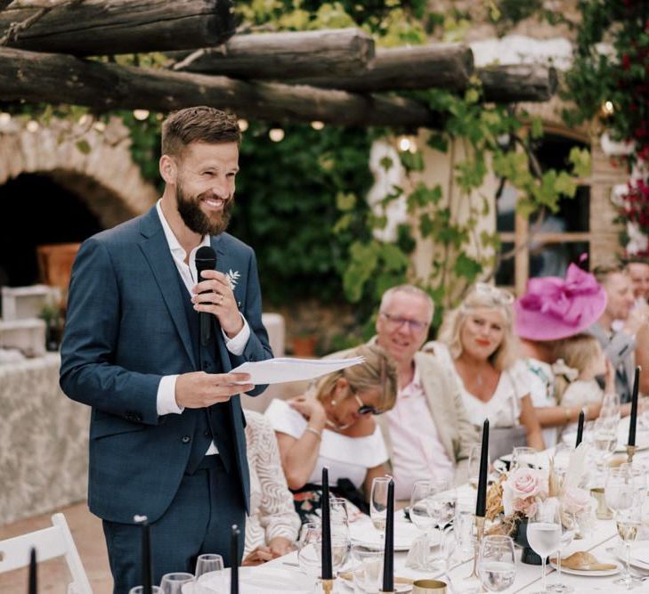 Bearded Groom in Navy Moss Bros. Suit Giving His Wedding Speech