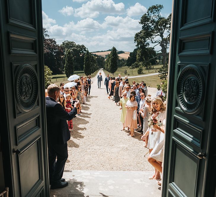 Wedding Guests Lining The Driveway of Pynes House, Devon Ready For The Bride and Groom Confetti Moment