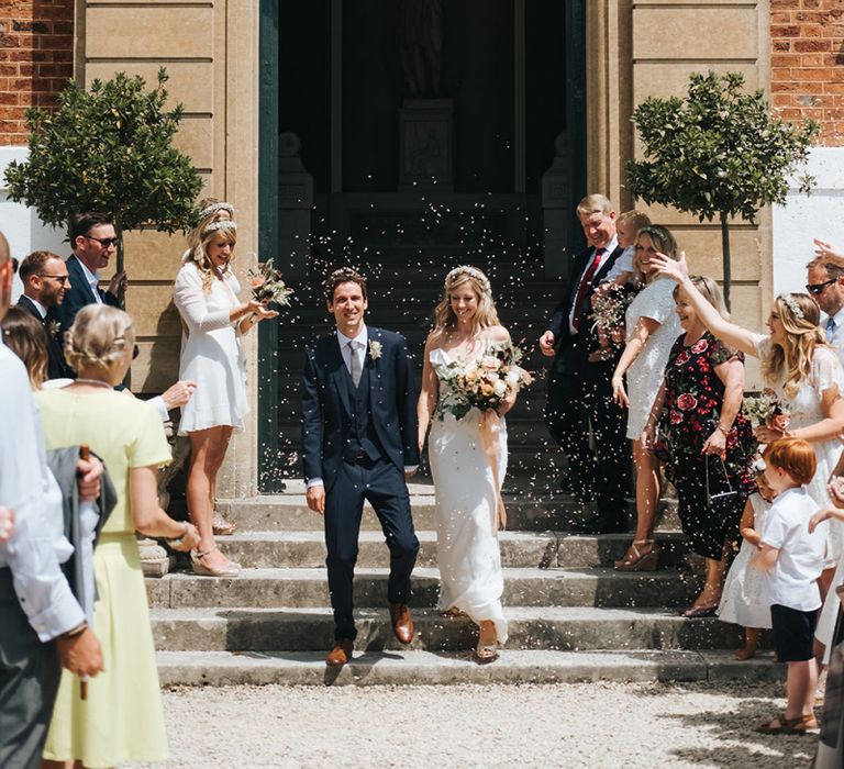 Bride and Groom Confetti Moment on the Driveway of Pynes House, Devon