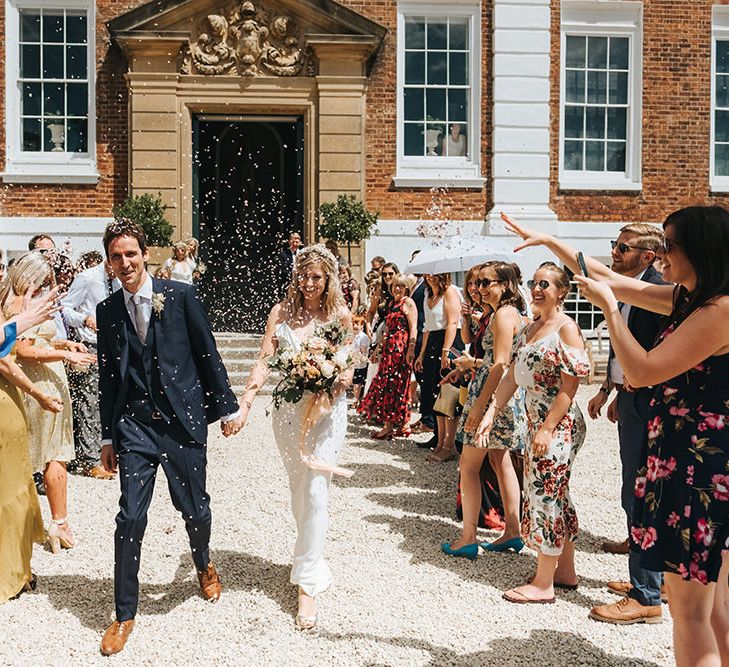 Confetti Moment with Bride in Savannah Miller Wedding Dress and Groom in Hugo Boss Suit