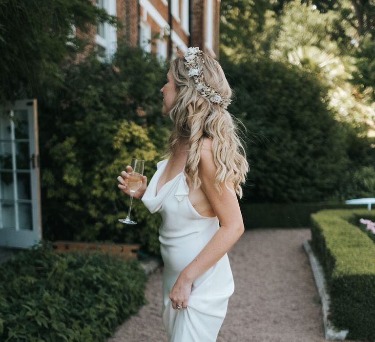 Boho Bride with Wavy Hair and Flower Crown in a Slinky Savannah Miller Chloe Wedding Dress