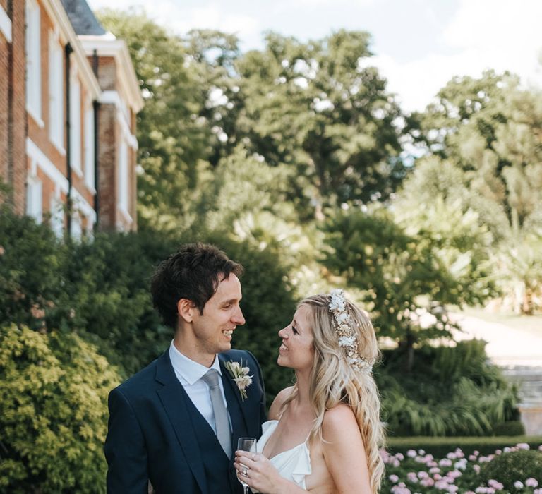 Bride and Groom Portrait with Bride in Minimalist Wedding Dress and Groom in Navy Suit