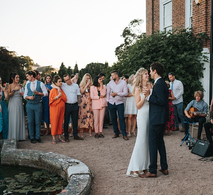 Bride and Groom Outdoor First Dance at Pynes House, Devon Surround By Their Wedding Guests