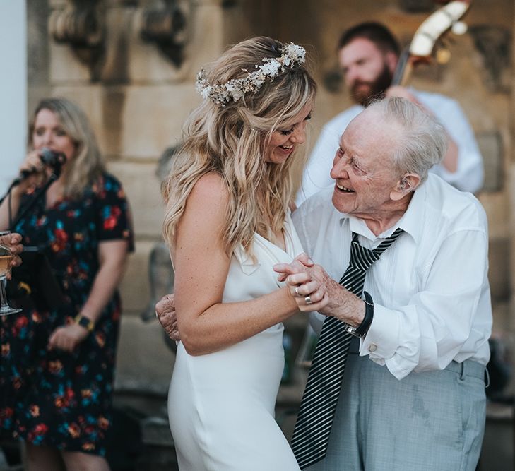 Boho Bride in Flower Crown and Slinky Wedding Dress Dancing With Her Grandad