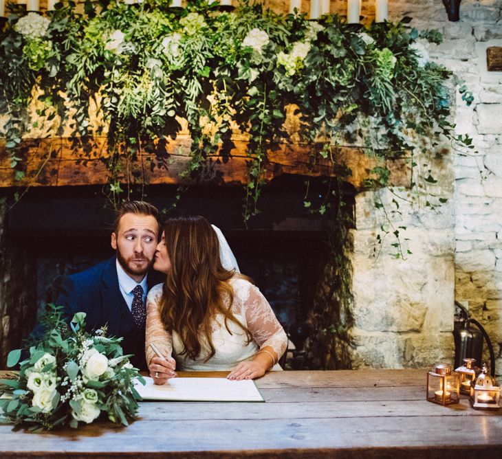 Signing The Register // Singing Waiters For A Foliage Filled Wedding At Cripps Barn // Charlie Brear Bride // Images By Ed Godden Photography // Film By WE ARE // THE CLARKES