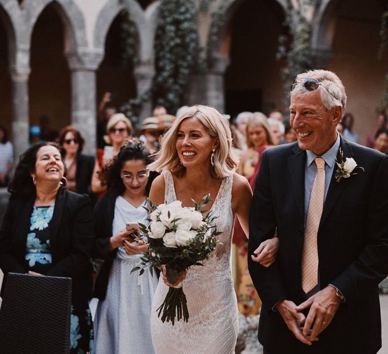 Peters Beach Sorrento wedding ceremony with bride in Enzoani dress