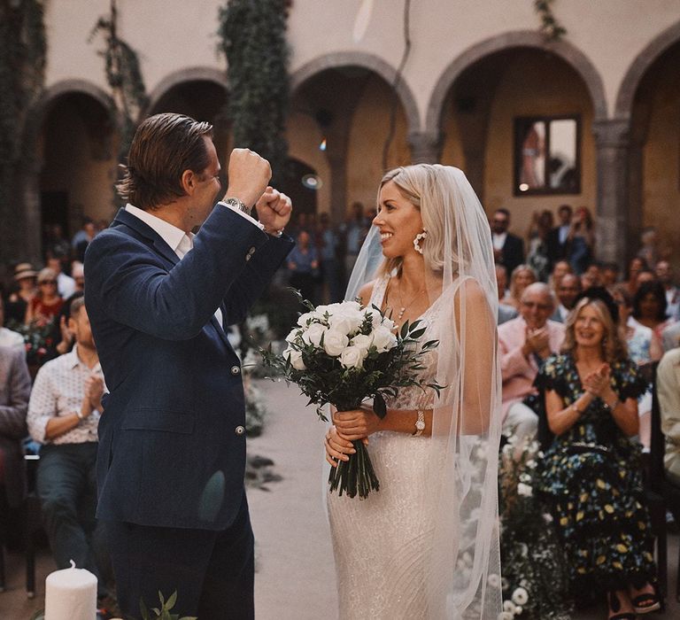 Bride and groom exchanging vows at Peters Beach Sorrento wedding