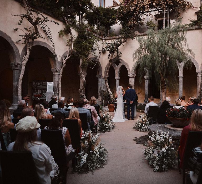 Peters Beach Sorrento wedding ceremony with white aisle flowers