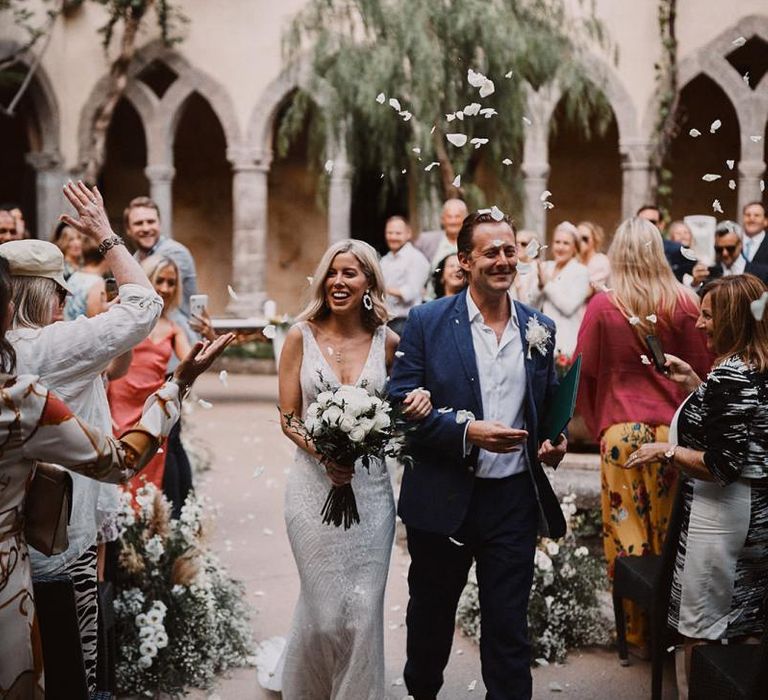 Bride and groom exiting the wedding ceremony at husband and wife