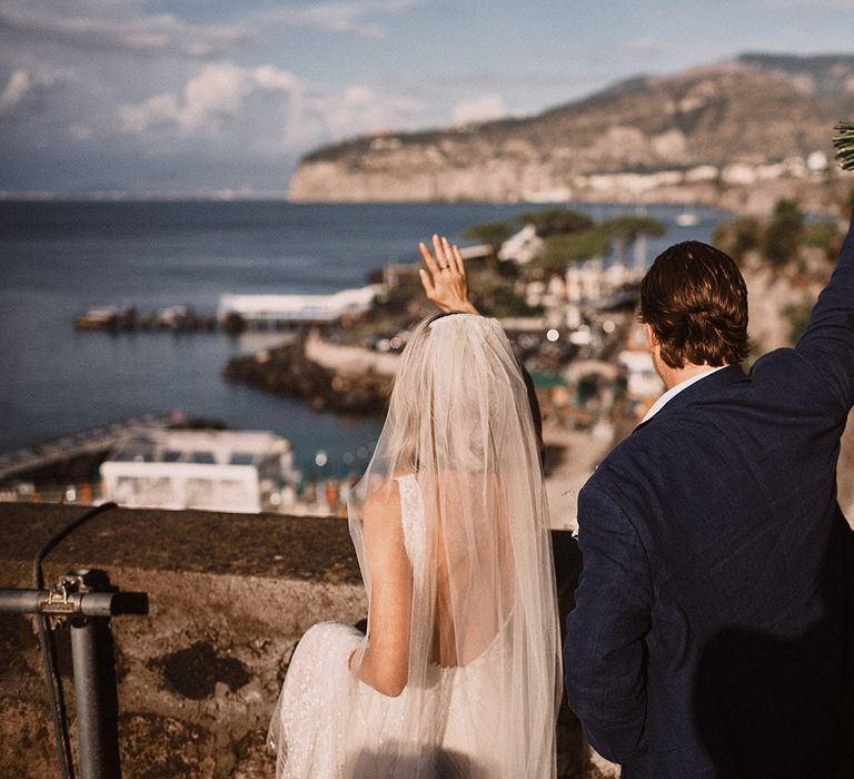 Bride and groom looking out to the marina at Peters Beach Sorrento