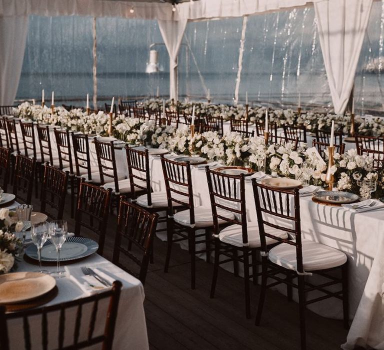 Clear span marquee with fairy lights and white flowers at Peters Beach Sorrento