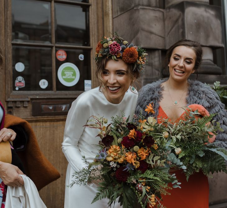 Beautiful Bride in Satin Wedding Dress and Autumn Wedding Bouquet