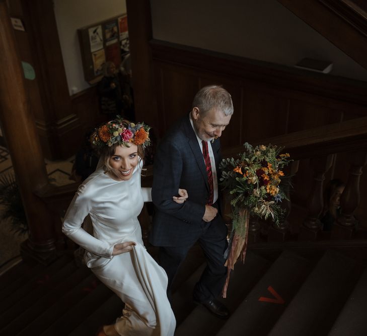 Bridal Entrance in Long Sleeve Satin Wedding Dress with Flower Crown