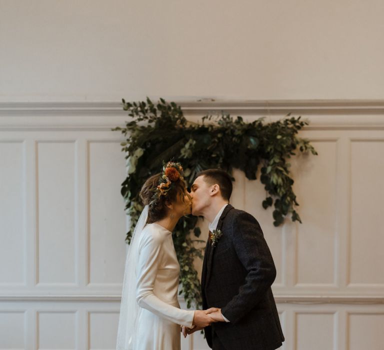 Bride and Groom Kissing at Wedding Ceremony