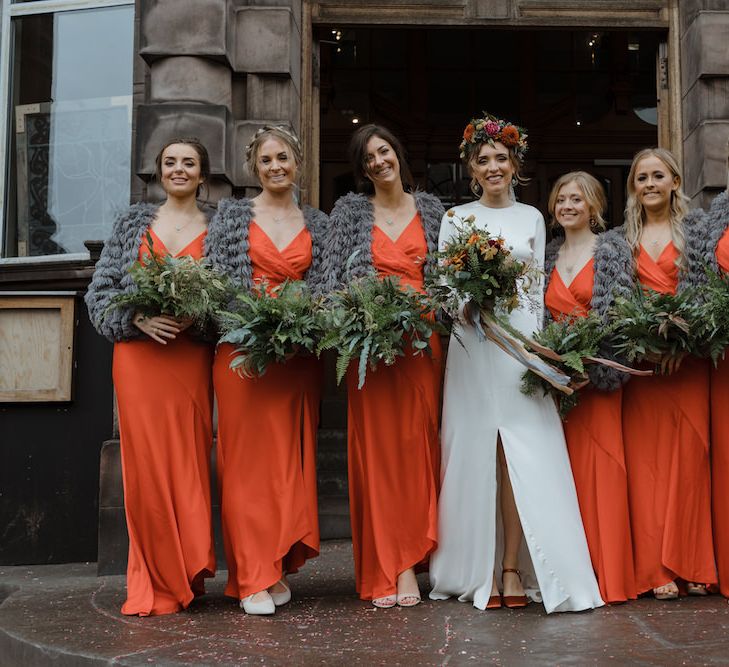 Bridal Party with Bridesmaids in Orange Wedding Dresses, Grey Cover Ups and Bride in Satin Wedding Dress