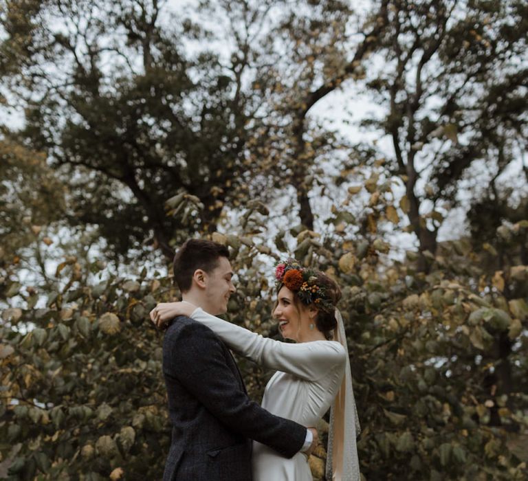 Bride and Groom Portrait with Autumnal Leaves on the Floor