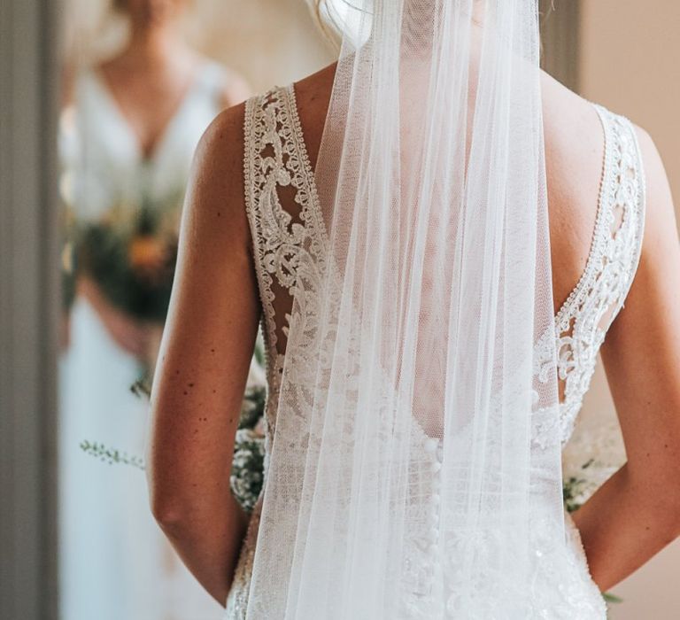 Pronovias Wedding Dress With Lace and Low Back Accessorised with Veil