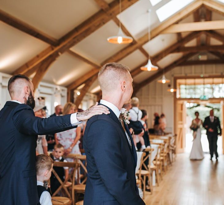 Groom Waits for Bride to Walk Down the Aisle