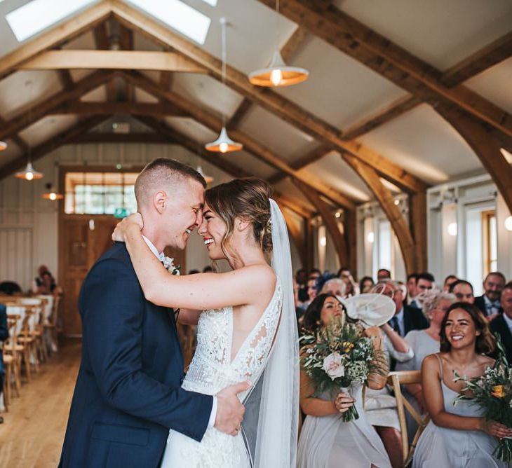 Bride and Groom Kiss During Ceremony