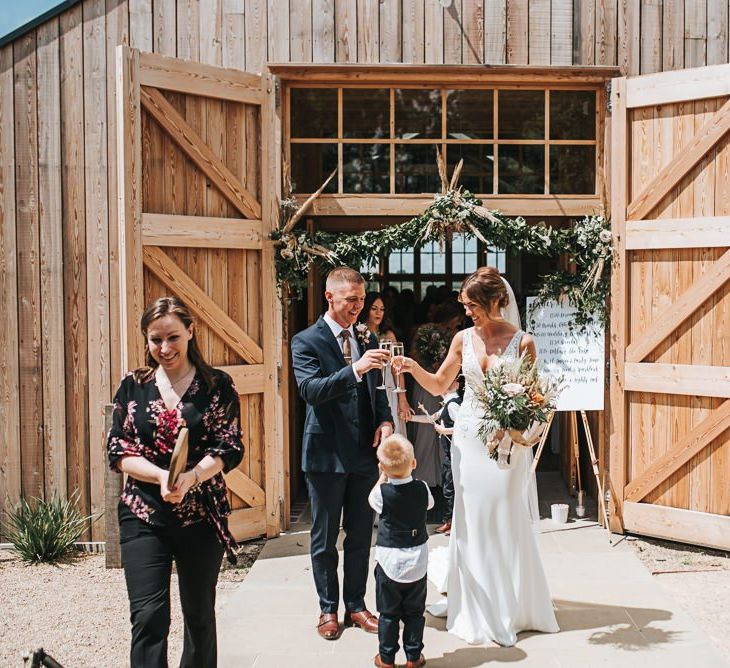 Bride and Groom Cheers After Ceremony