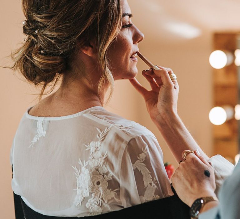 Bridal Beauty Makeup Preparations With Low Loose Bun