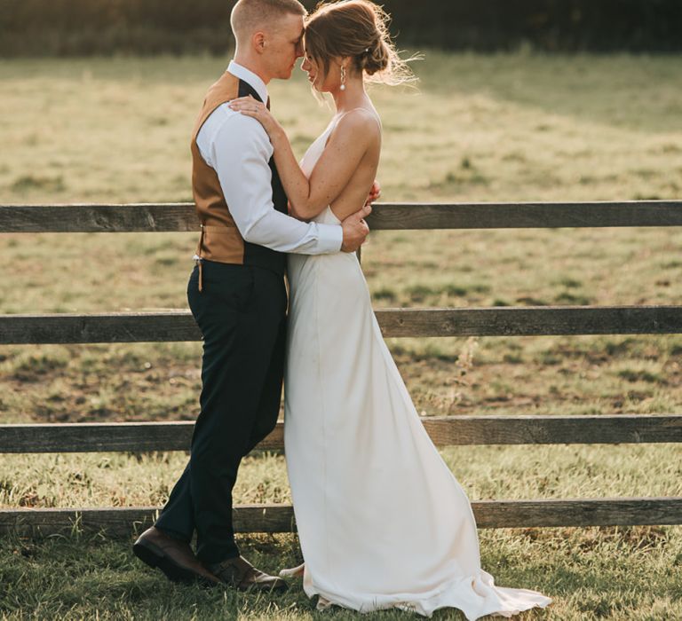 Groom in Waistcoat With Bride In Low Back Dress