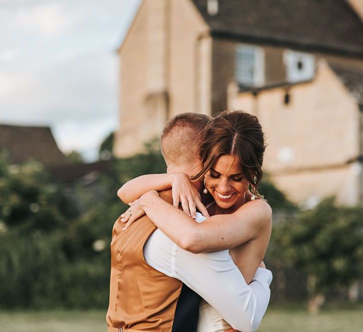 Bride and Groom Embrace