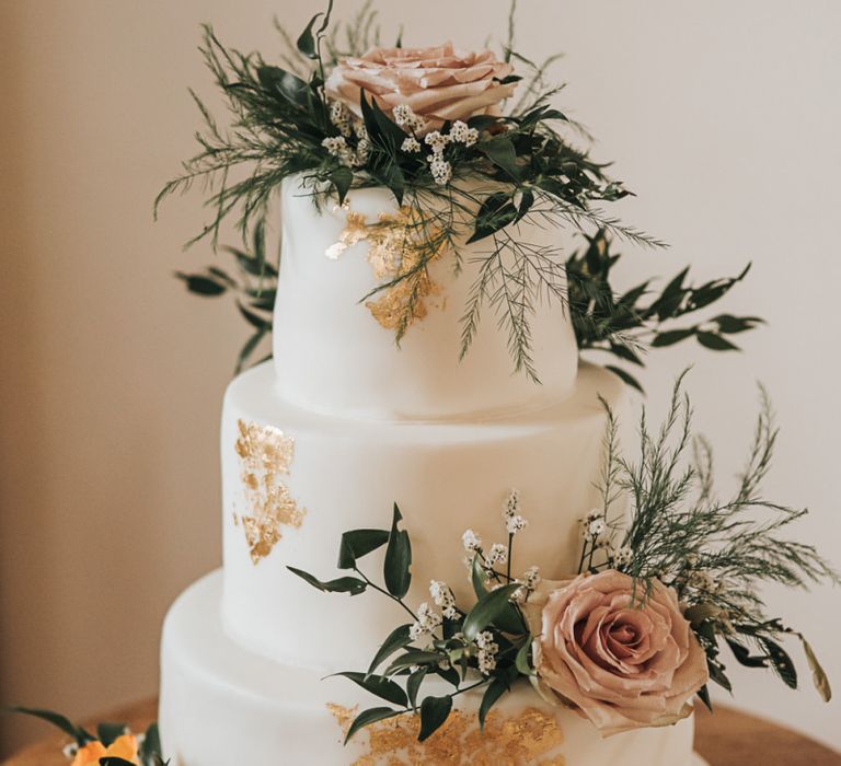 Wedding Cake With Gold Leaf Detail and Flowers