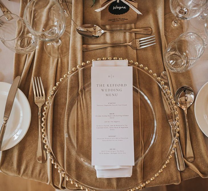 Gold Trimmed Plates with Wedding Stationery