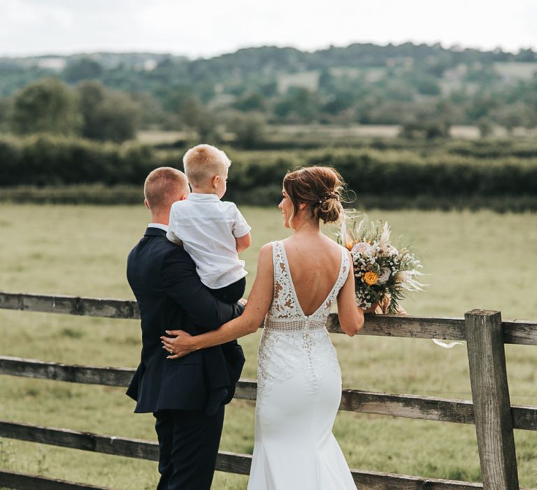 Bride and Groom Take A Moment With Their Son