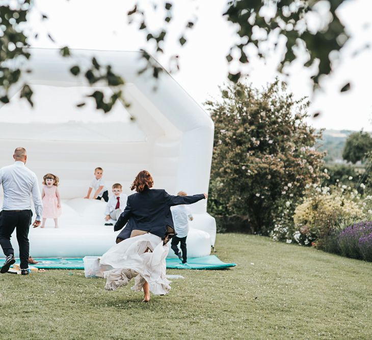 White Bouncy Castle For Guests To Enjoy