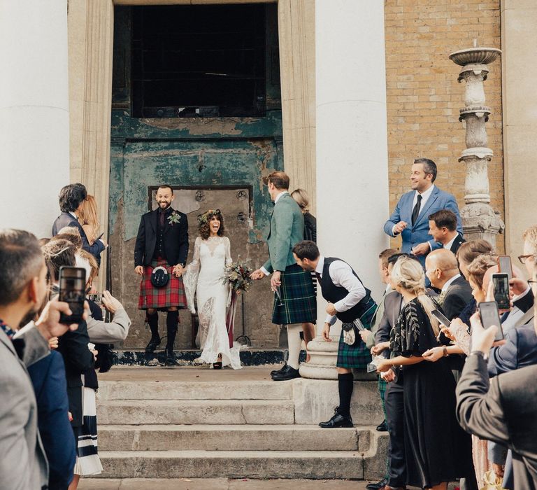 Confetti Exit with Bride in a Boho Rue De Seine Wedding Dress and Groom in Red Tartan Kilt