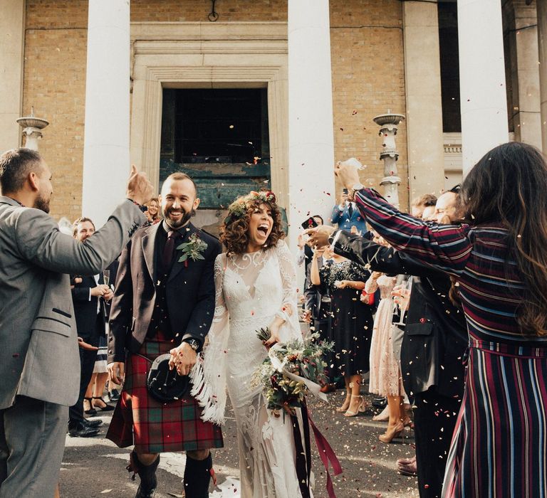 Confetti Moment with Bride in a Boho Rue De Seine Wedding Dress and Groom in Red Tartan Kilt