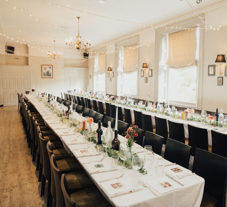 Wedding Reception at The Rosendale with Eucalyptus Table Runners, Fairy Lights and Bottles with Candles in