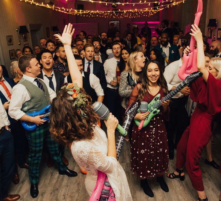 Bride and Groom Sining Karaoke First Dance with Inflatable Props