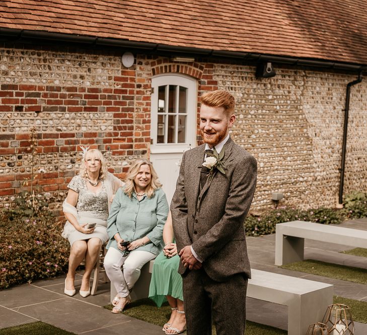 Groom at the altar of socially distanced 2020 wedding