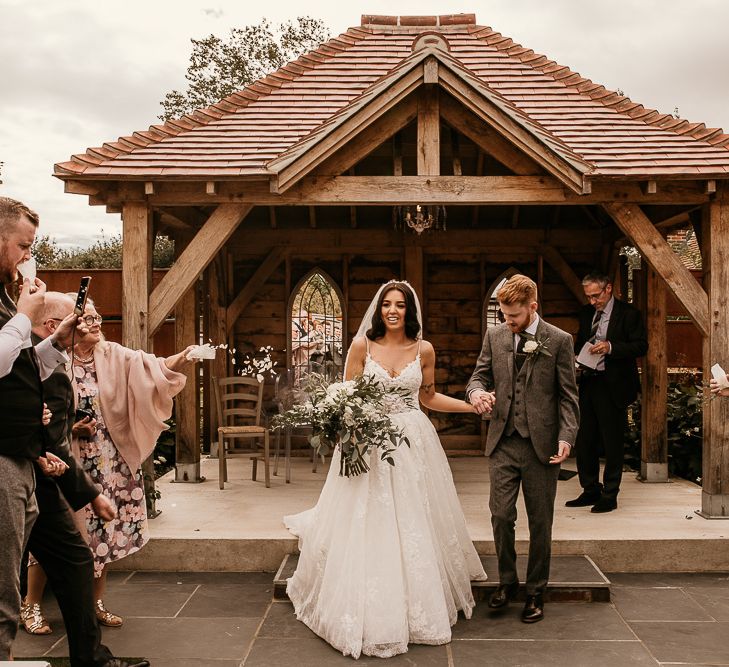 Bride and groom just married at intimate outdoor wedding ceremony