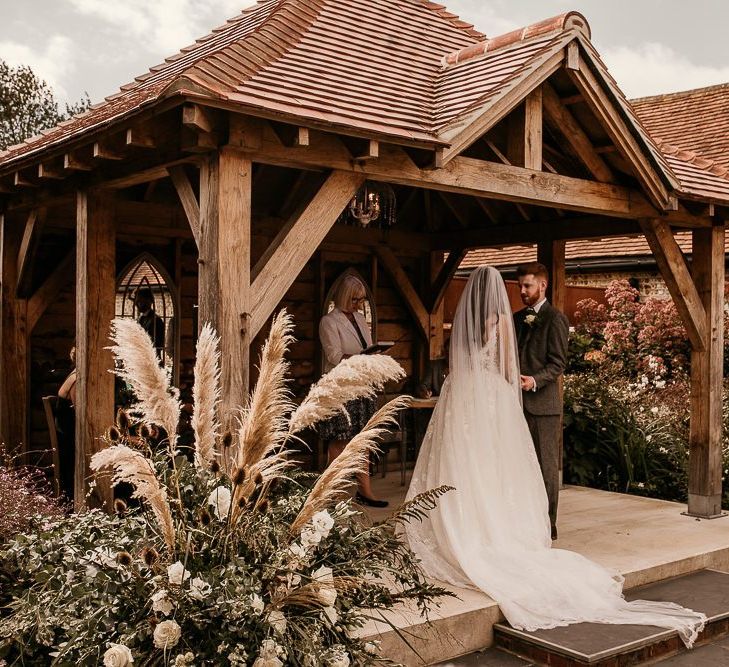 Outdoor wedding ceremony at Southend Barns wedding venue