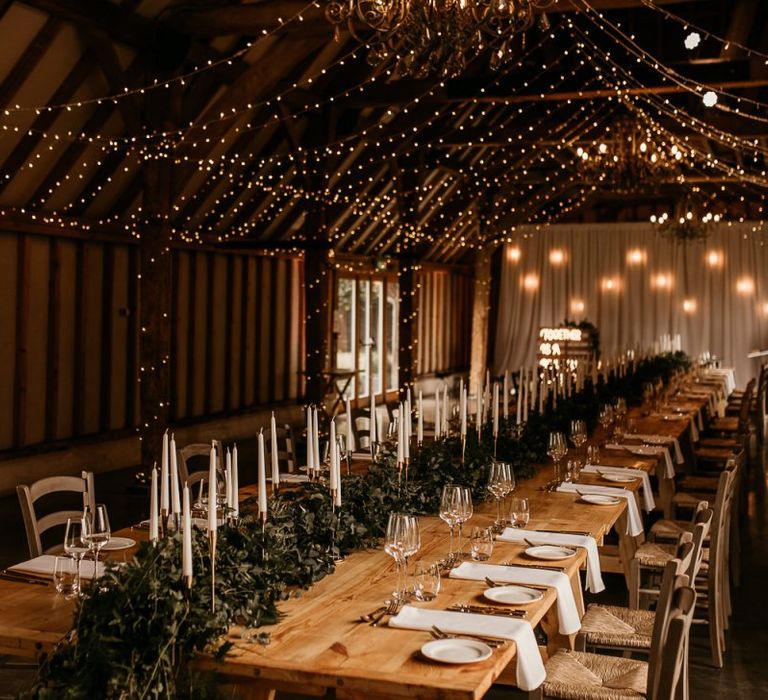 Southend Barns wedding reception with taper candles and fairy lights