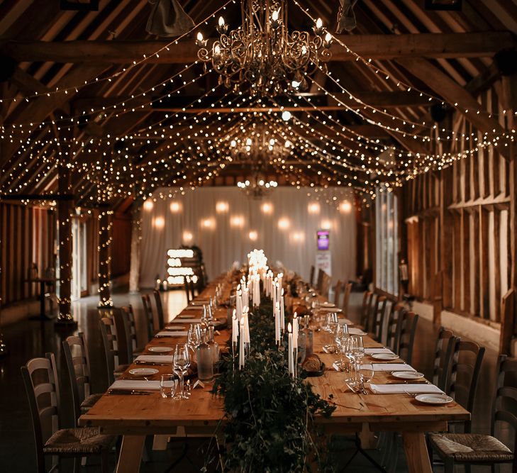 Small wedding reception at Southend Barns with romantic candlelight  and fairy light canopy