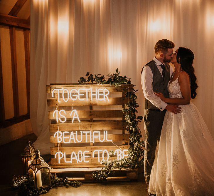 Neon wedding sign at rustic wedding