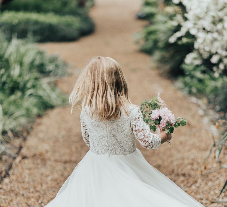 Flower Girl In White Dress // Disney Princess Bride Sleeping Beauty Inspired Wedding With Opulent Florals And Bride In Blush Pink With Images From Rebecca Carpenter Photography