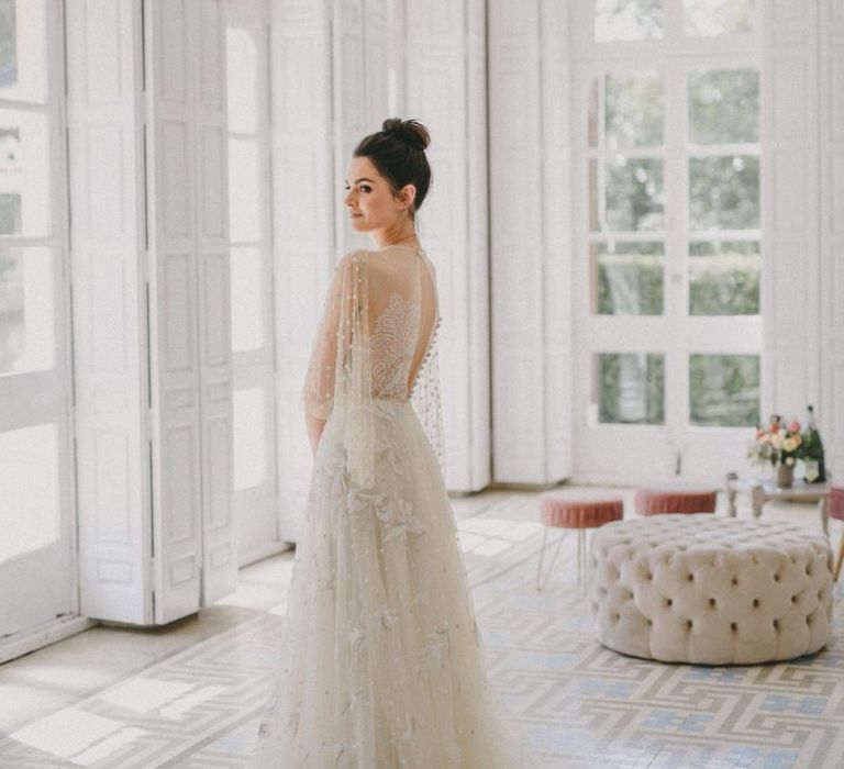 Bride in Marco y María Wedding Dress with Top Knot